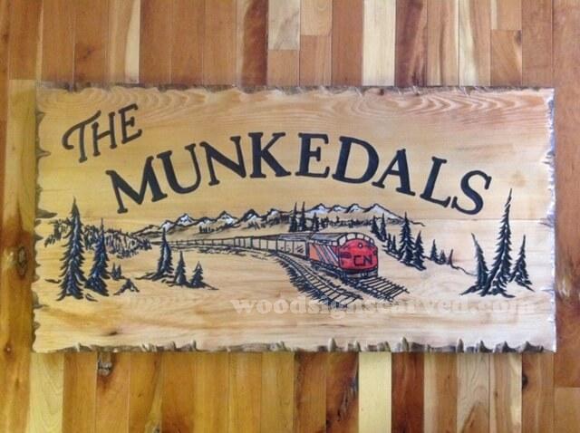 The Munkedals - a custom carved cedar wood sign from Woodpecker Signs