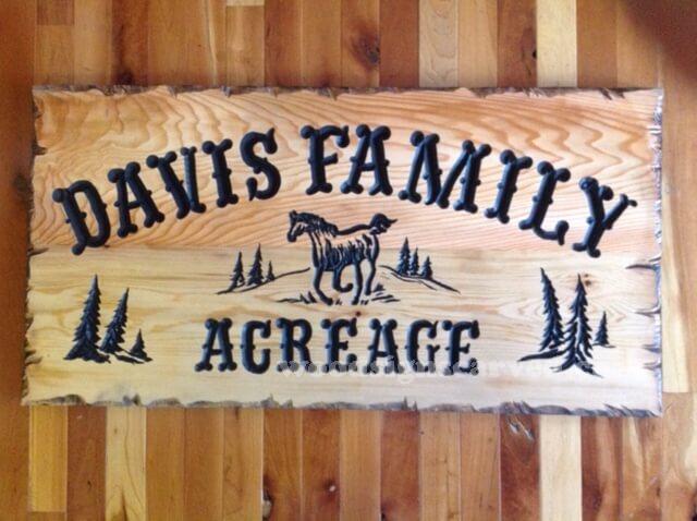 Davis Family - a custom carved cedar wood sign from Woodpecker Signs