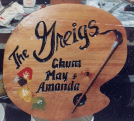 The Greigs - a custom carved wood sign from Woodpecker Signs