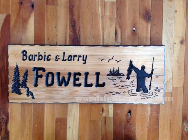 Barbie and Larry Fowell - a custom carved cedar wood sign from Woodpecker Signs